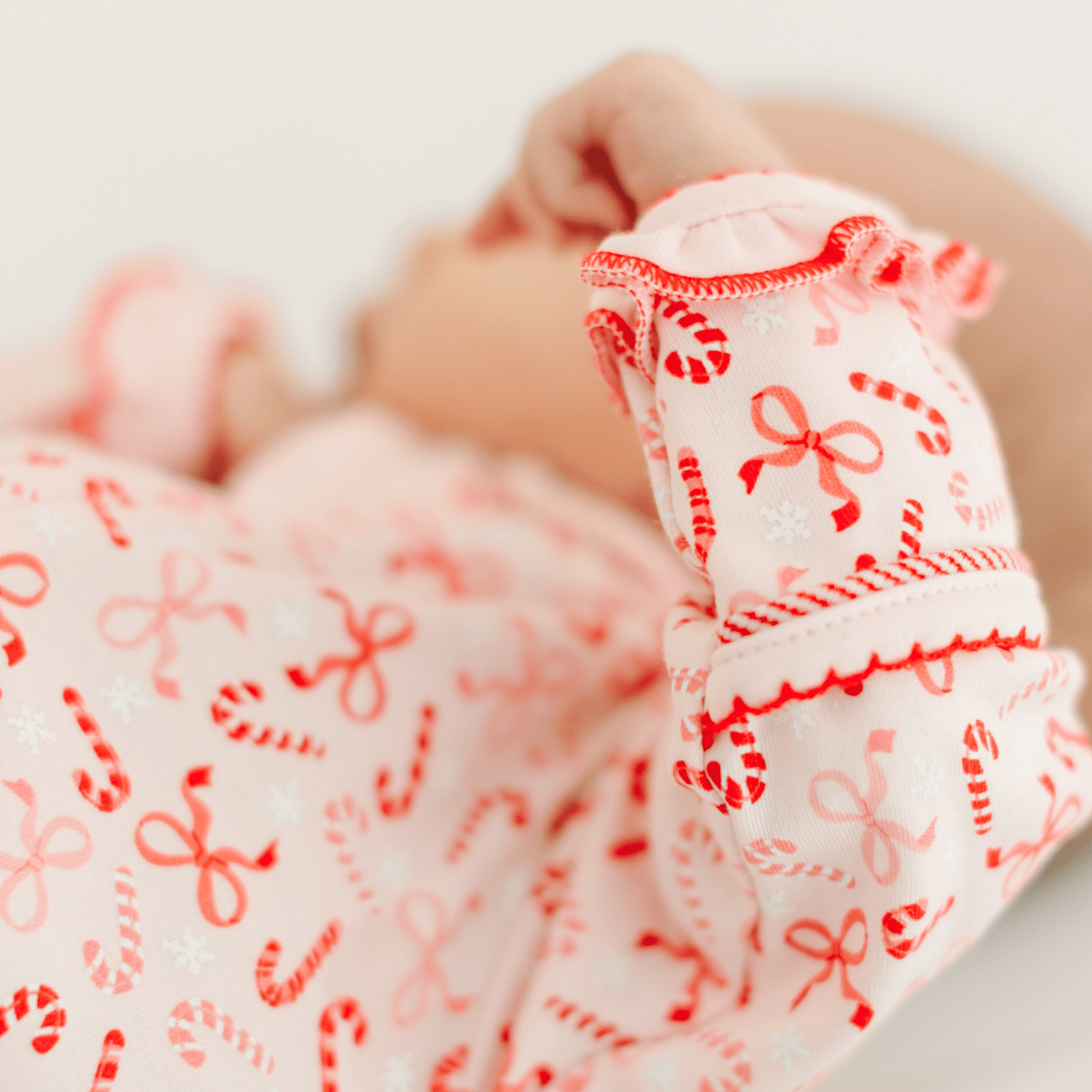 Candy Cane Lane Print Ruffle Zip Footie - Magnolia BabyFootie