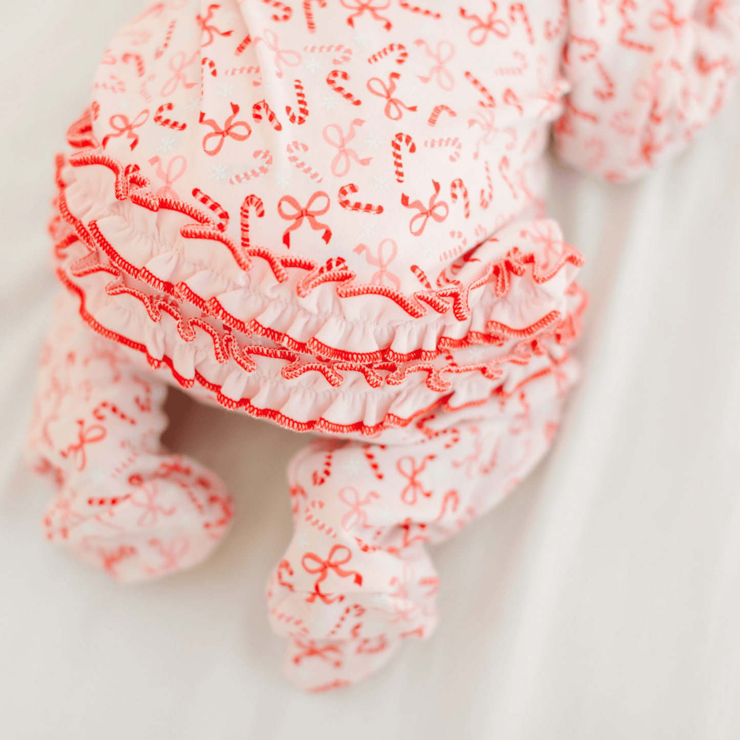 Candy Cane Lane Print Ruffle Zip Footie - Magnolia BabyFootie