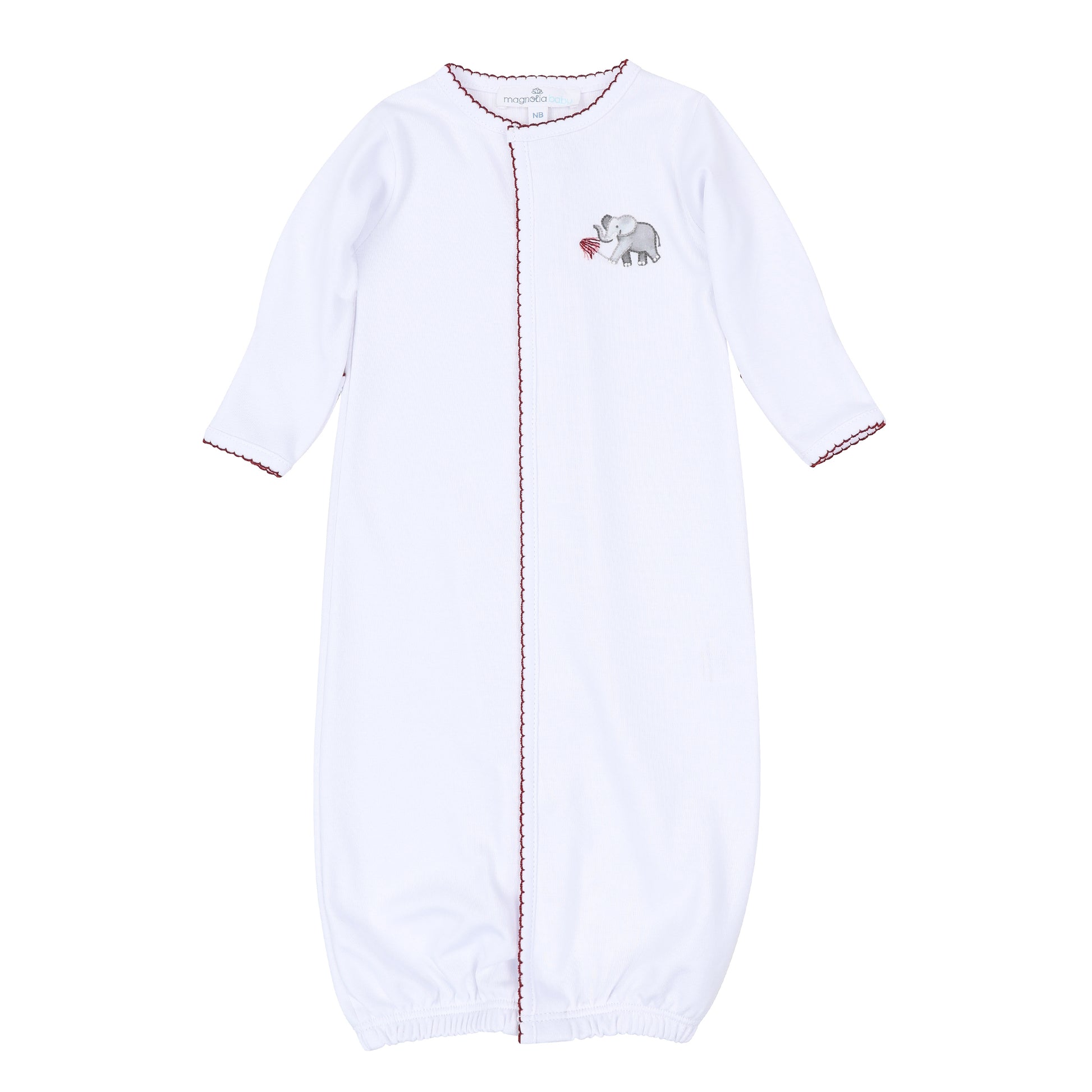 White long-sleeve baby converter gown with deep crimson scalloped trim, front opening, gathered bottom, and embroidered elephant holding a pom detail.