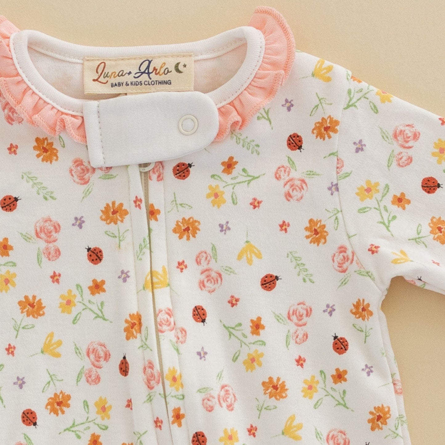 Bugs and Blossoms Ruffle Zip Footie - Luna and ArloFootie