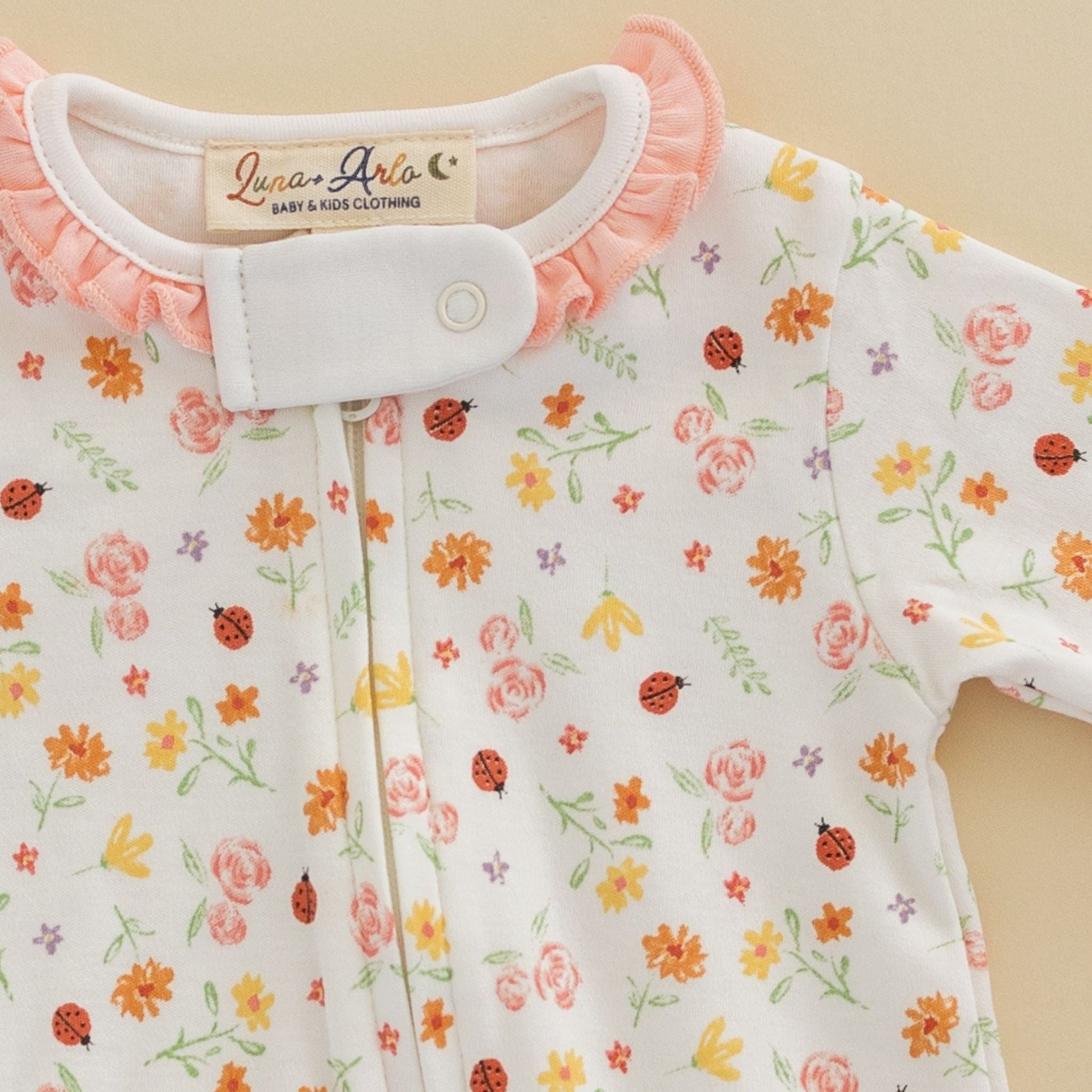 Bugs and Blossoms Ruffle Zip Footie - Luna and ArloFootie