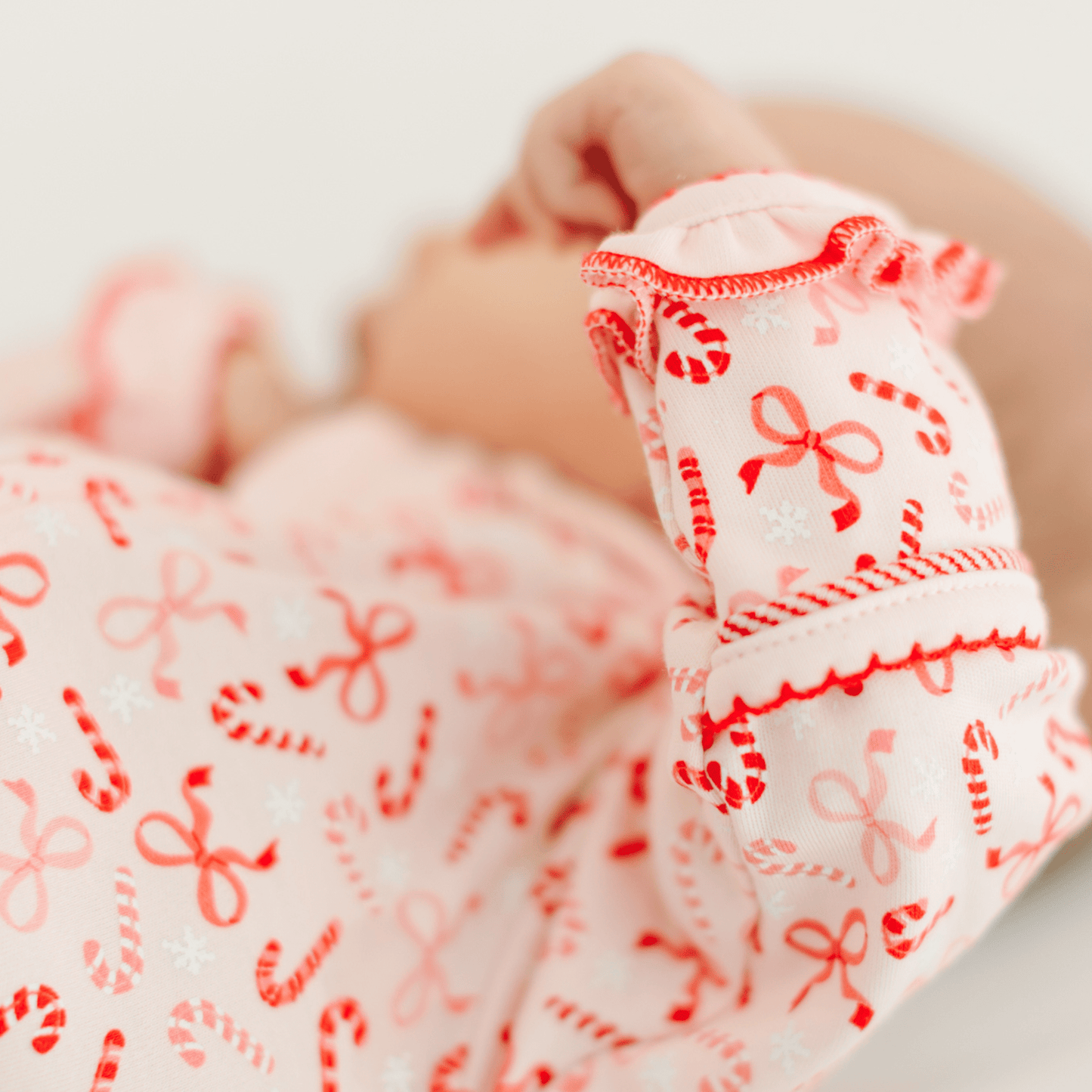 Candy Cane Lane Print Ruffle Zip Footie - Magnolia BabyFootie
