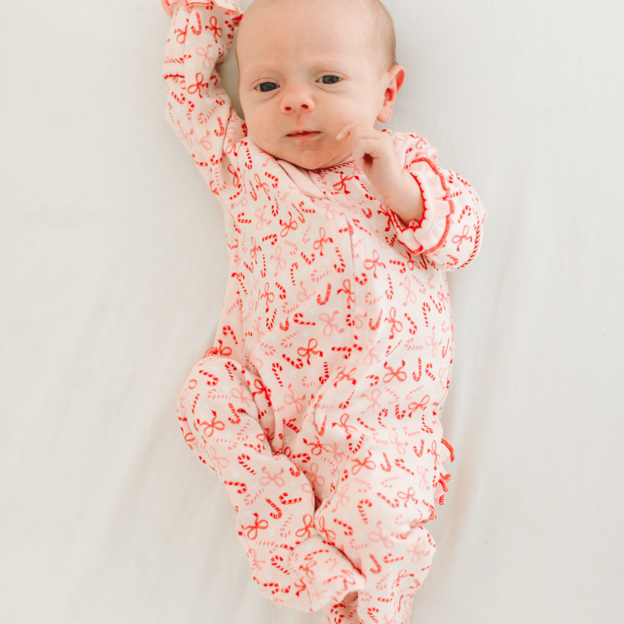 Candy Cane Lane Print Ruffle Zip Footie - Magnolia BabyFootie