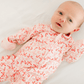 Candy Cane Lane Print Ruffle Zip Footie - Magnolia BabyFootie