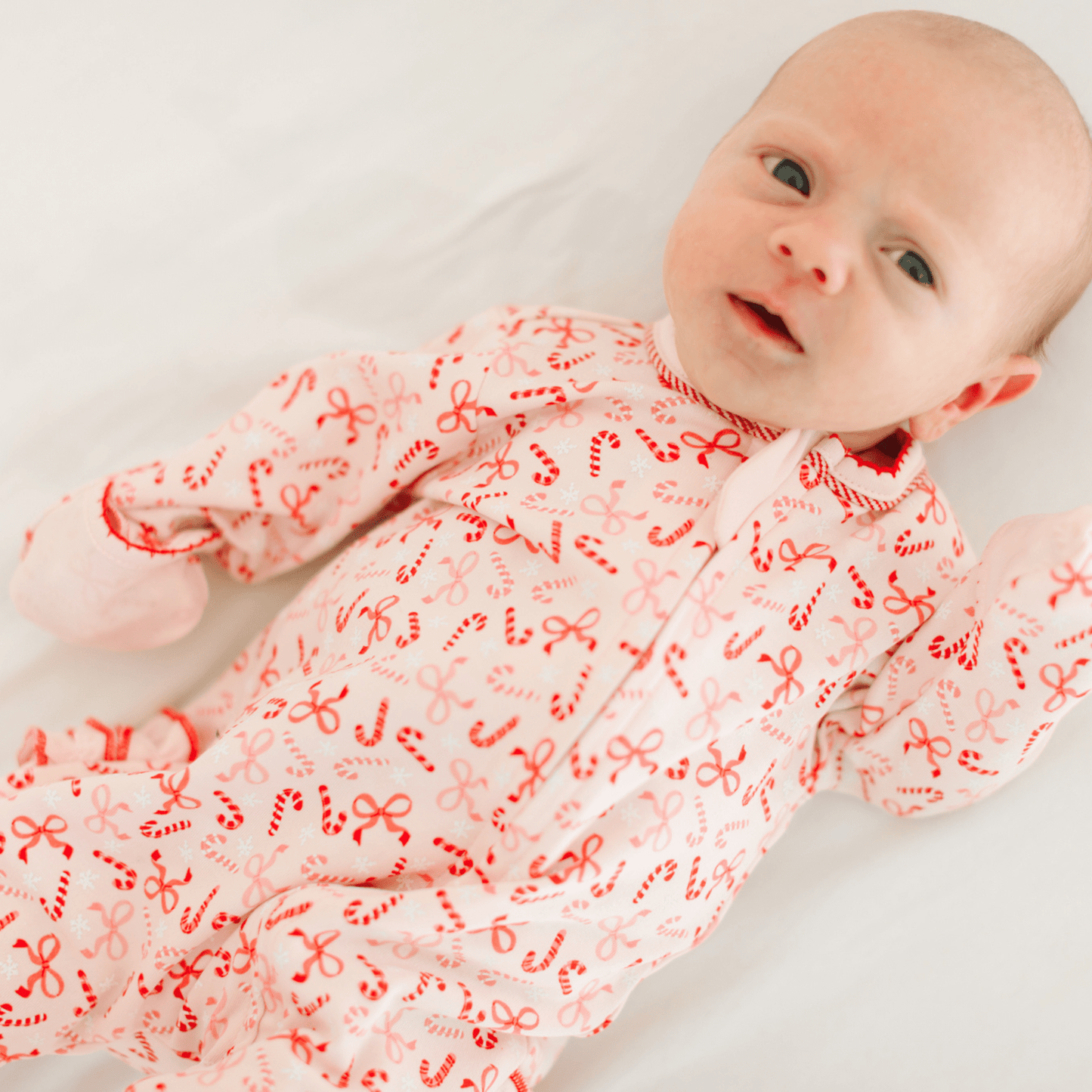 Candy Cane Lane Print Ruffle Zip Footie - Magnolia BabyFootie