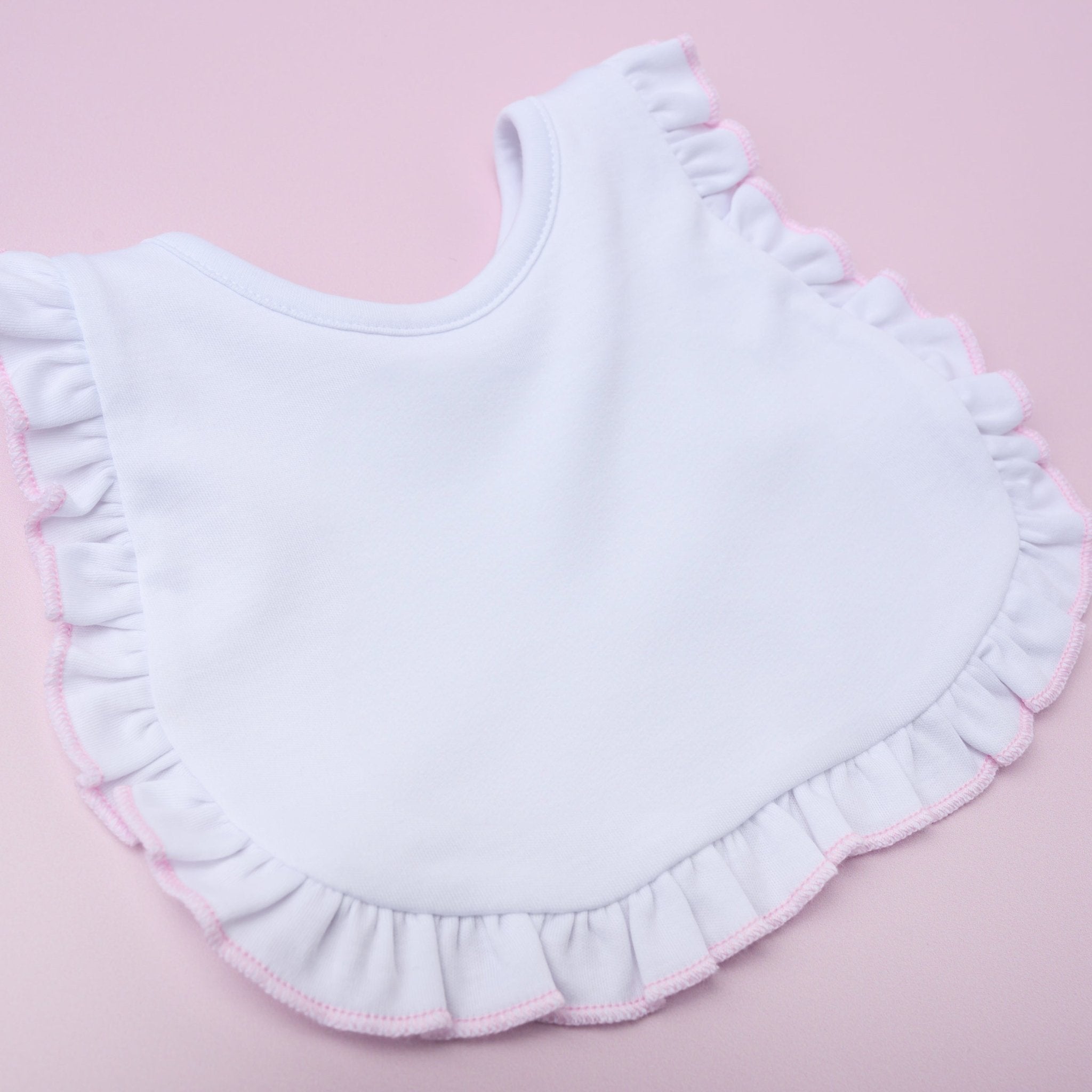 Essentials White Bib with Pink Ruffle - Magnolia BabyBib