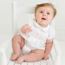  baby girl in a christening baptism smocked bubble in pink