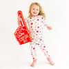 Child wearing bulldog footall pajamas with a foam hand on a white background